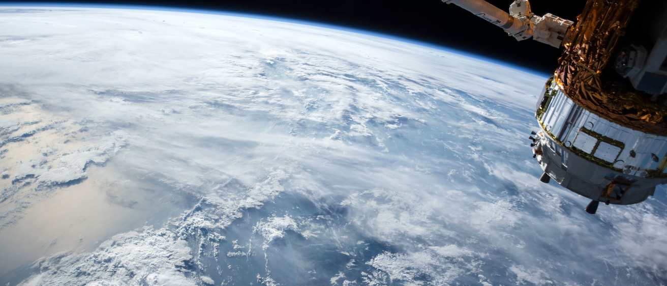 Image of a Earth-orbiting satellite and the Earth below.